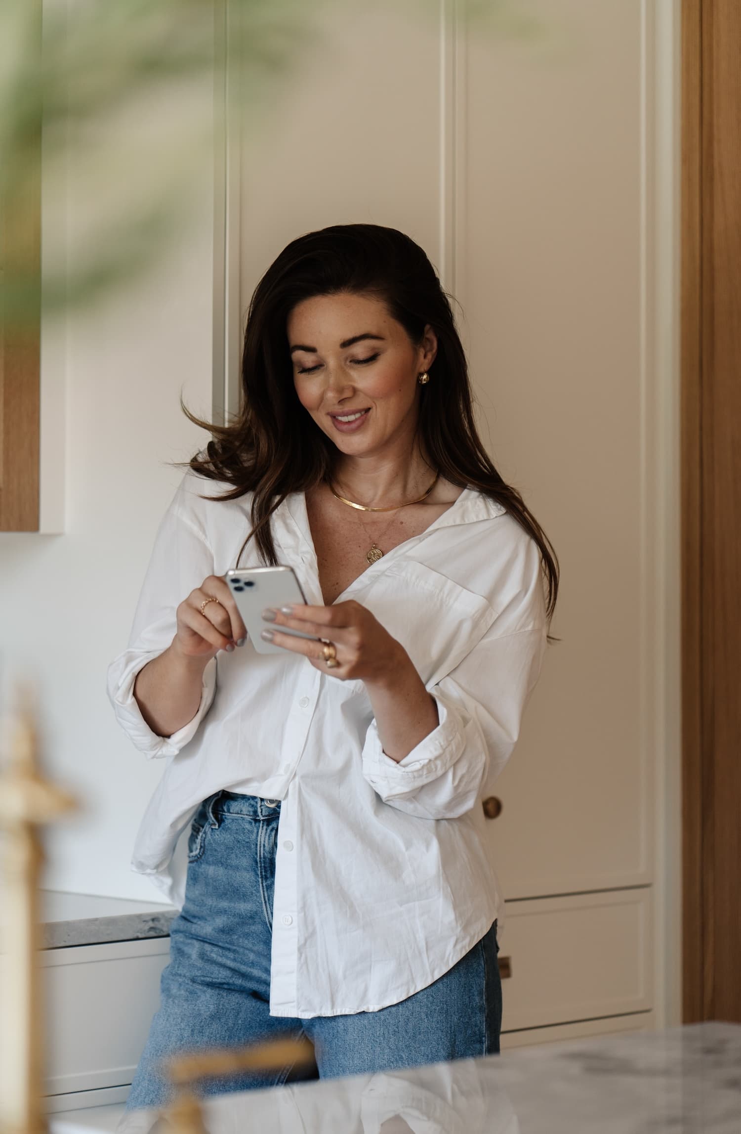 Stylist organizing photos on mobile device